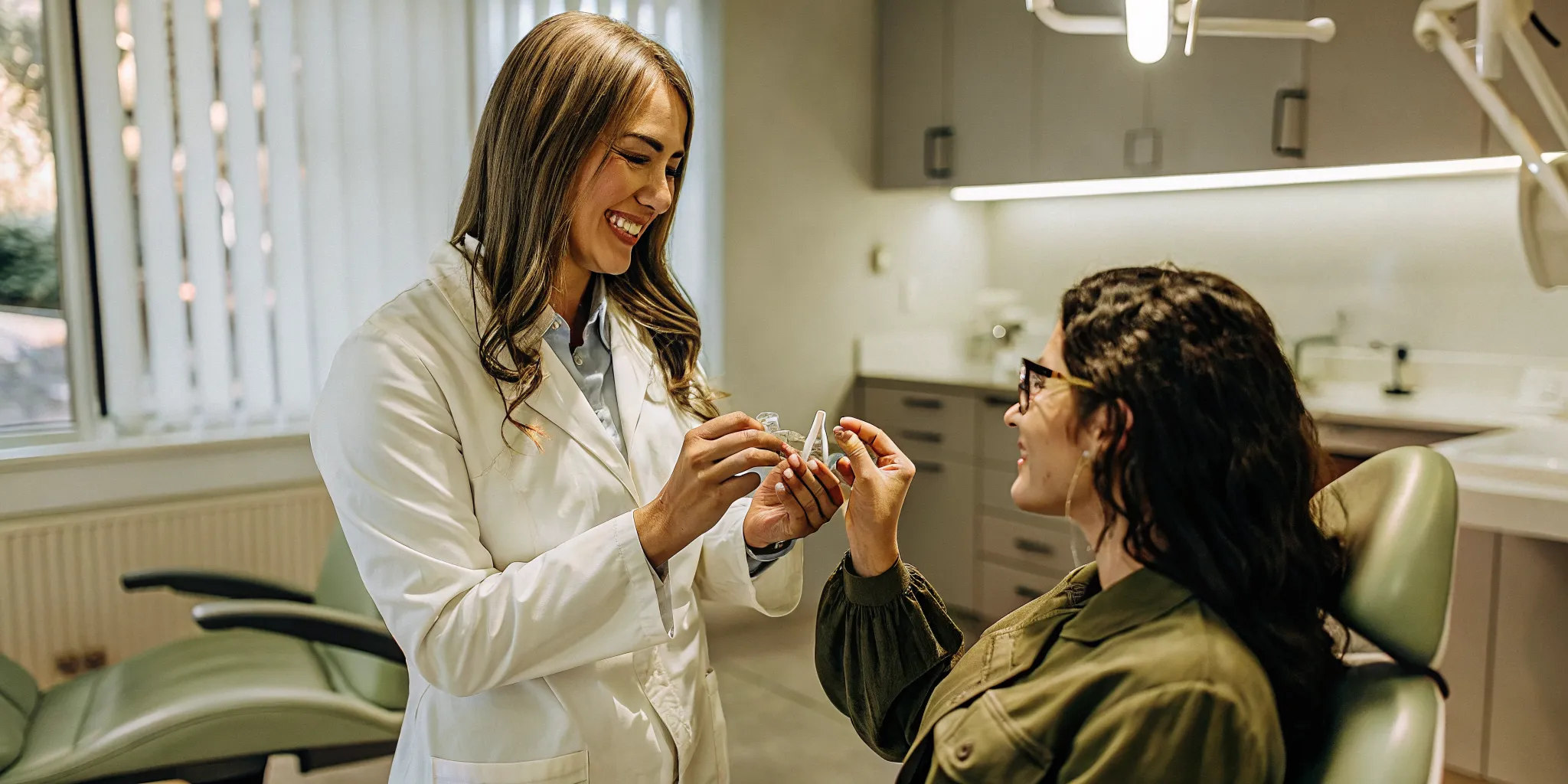 San Diego dentist comparing clear aligner and braces treatment options with a patient during a consultation
