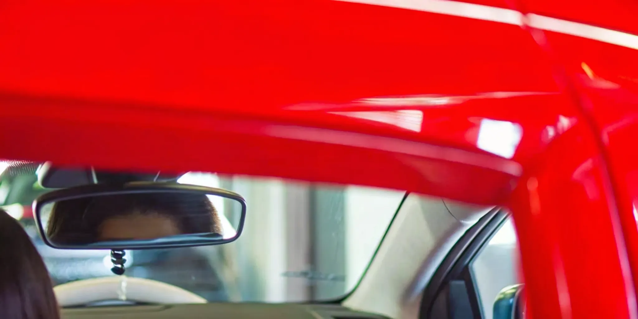 Forward-facing ADAS camera mounted behind a vehicle windshield