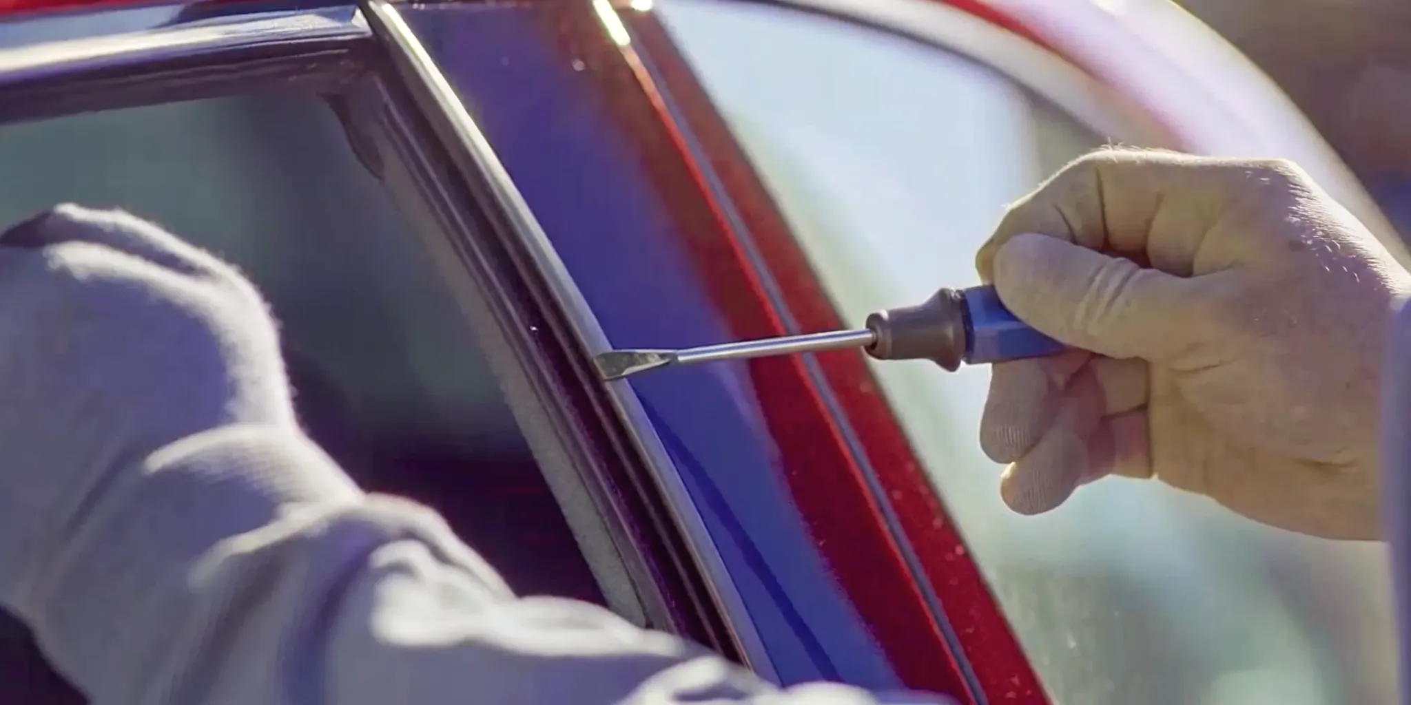 Technician repairing a small chip on a windshield in Kansas City