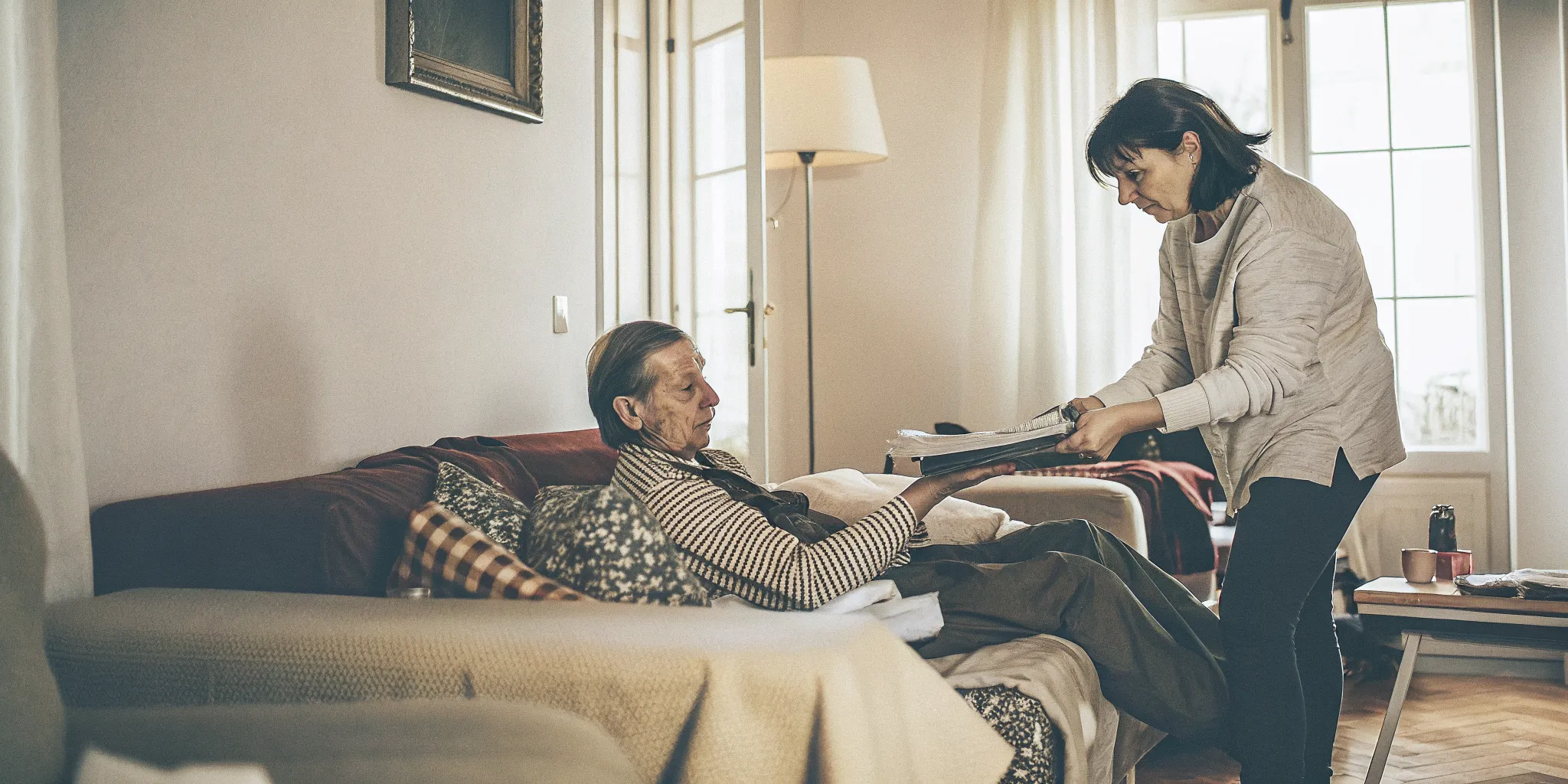 A Florida worker recovering at home with help organizing recovery notes after a long-term disability