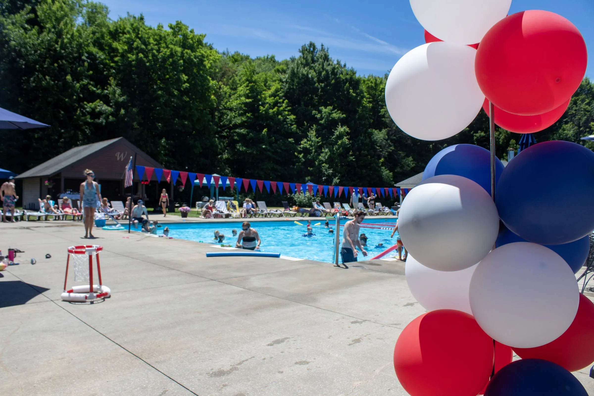 Families enjoying an afternoon around the outdoor pool at The Wembley Club in Chagrin Falls
