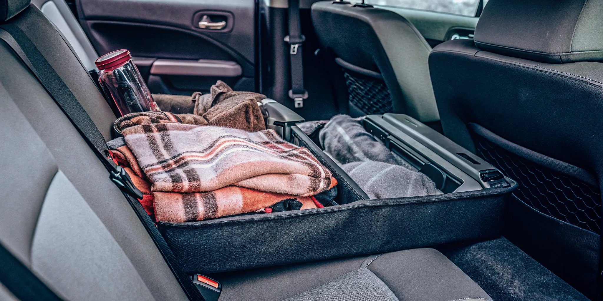 Winter emergency survival kit for fleet vehicles with blankets, flashlight, food and scraper