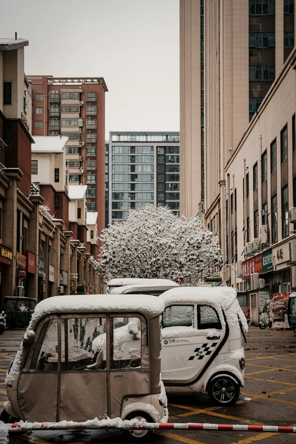 Electric vehicle plugged in at a charging station during winter travel