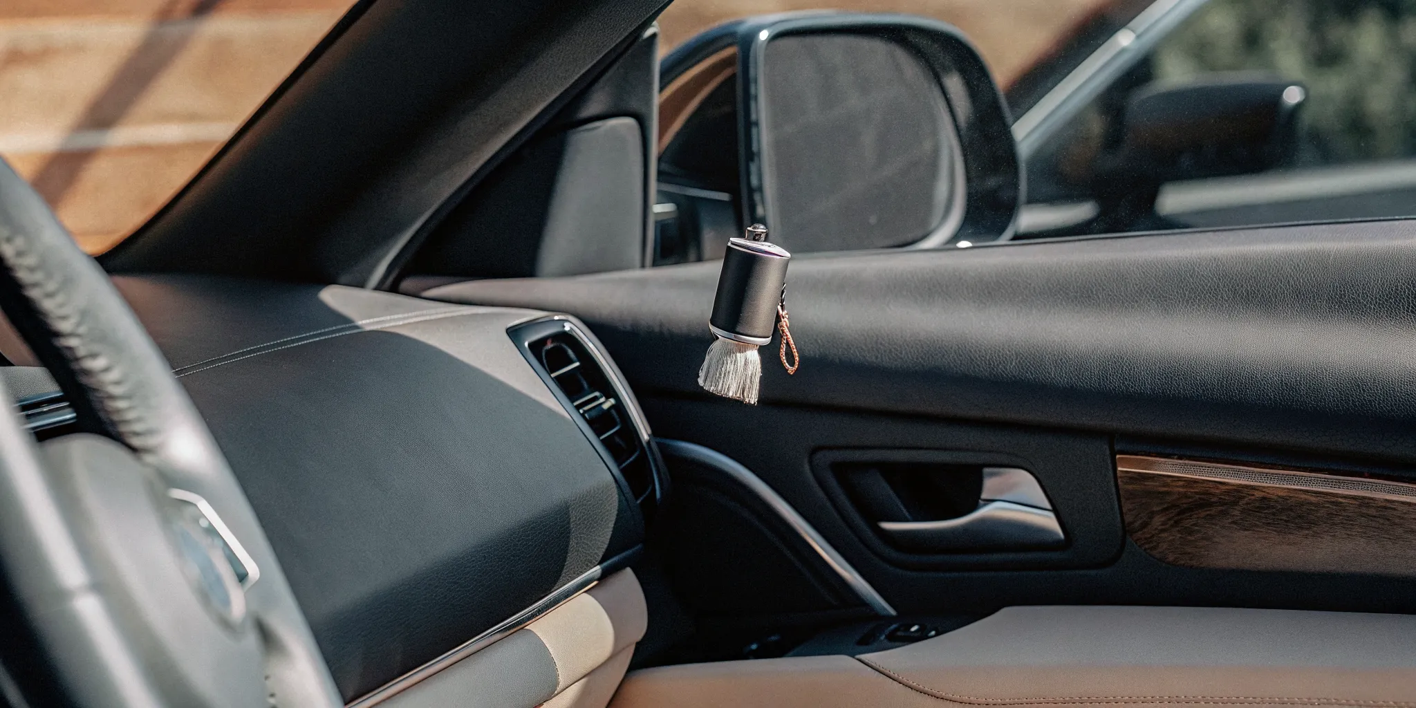 Minimal car diffuser in a clean modern vehicle interior