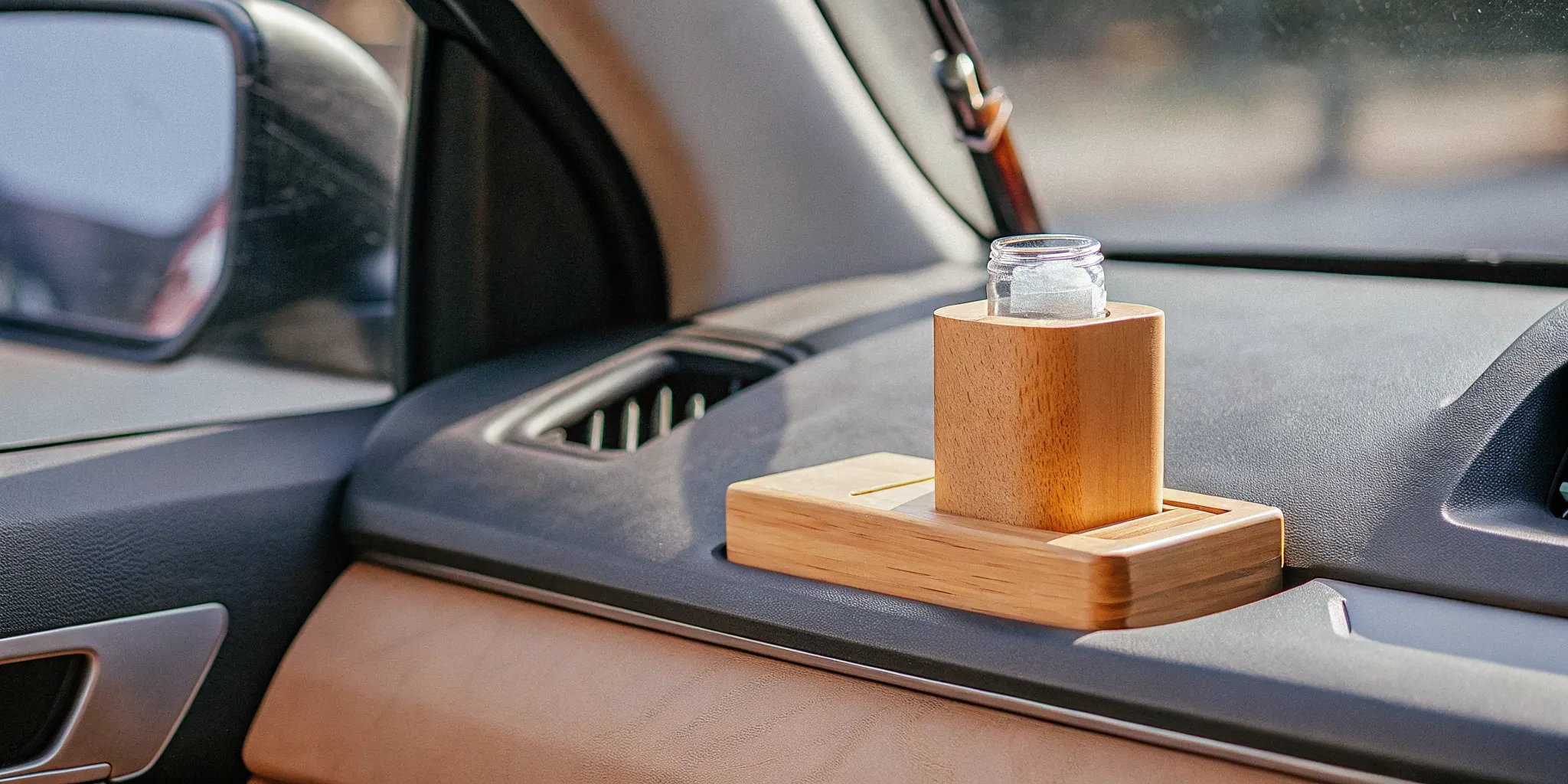 Clean modern car interior with a subtle wood car fragrance diffuser