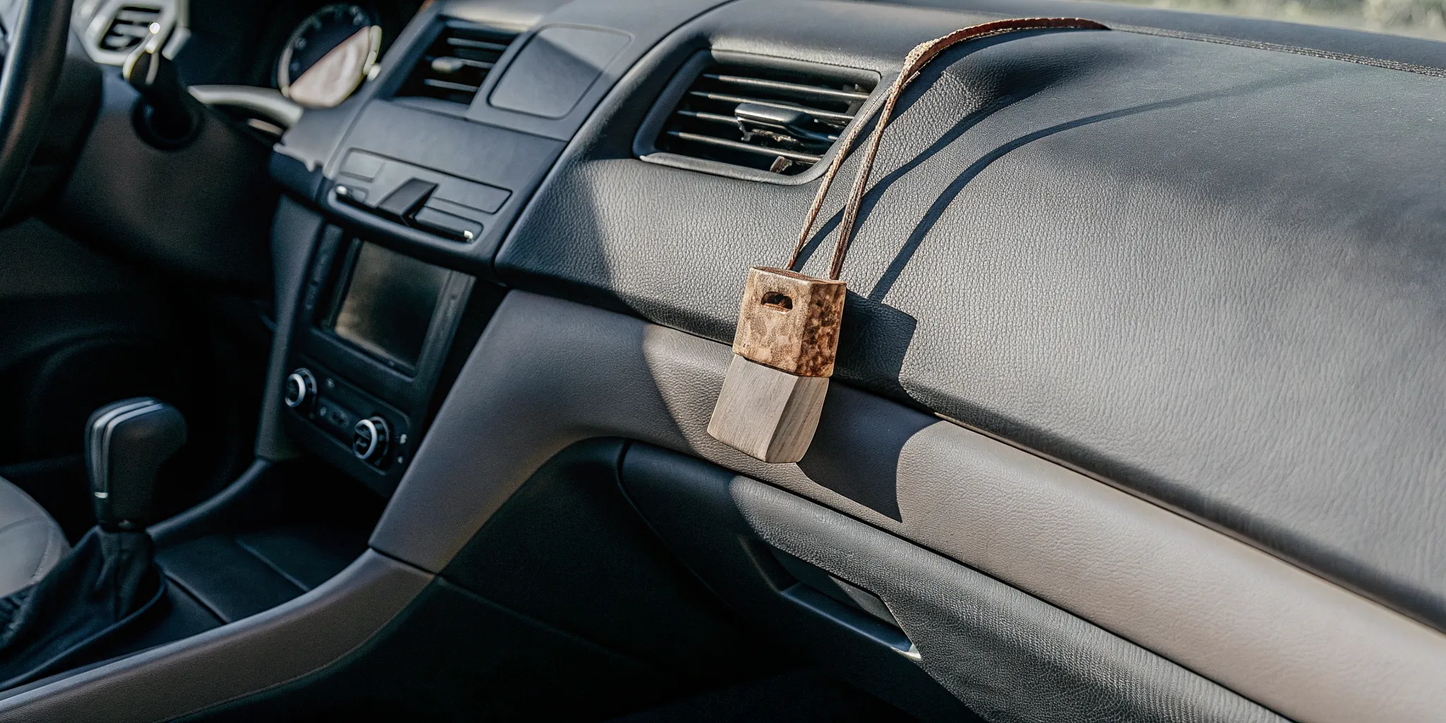 Natural wood car scent diffuser with raw material samples