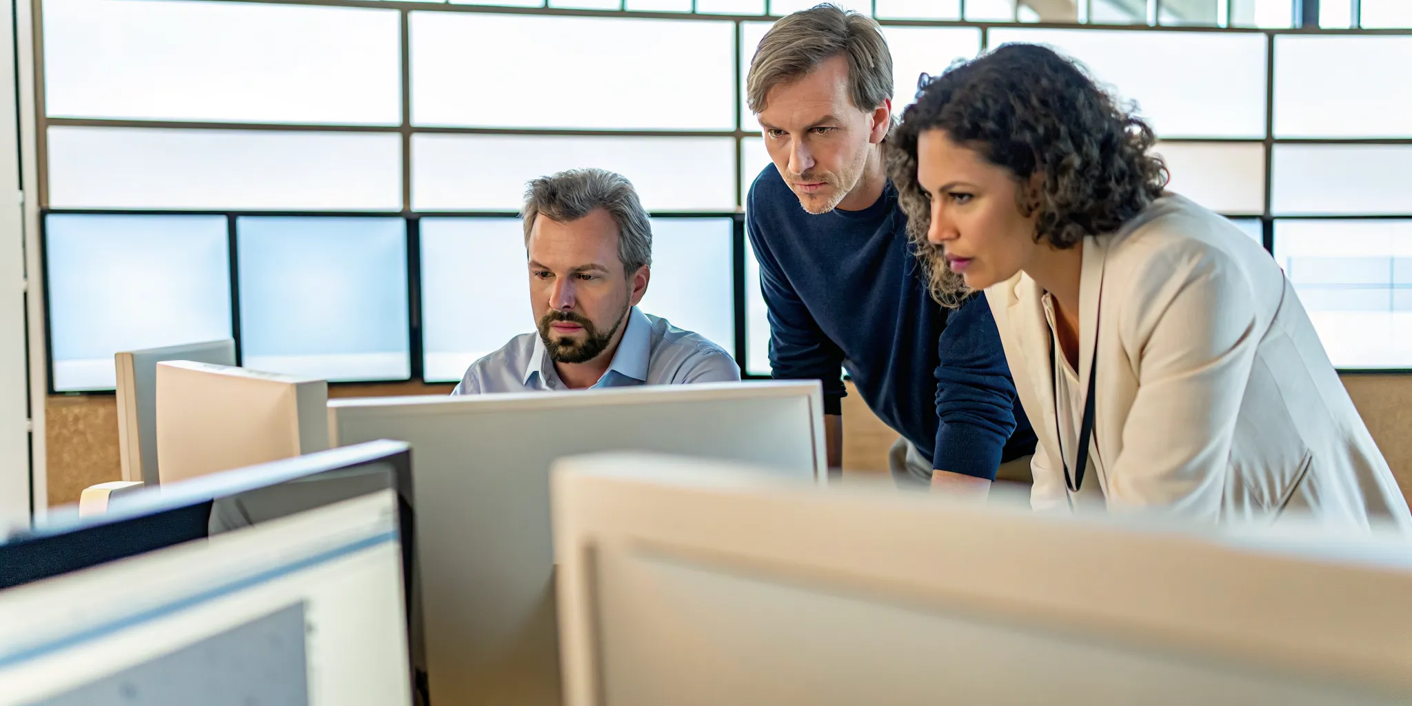 Outsourced IT help desk support specialists collaborating on an escalation
