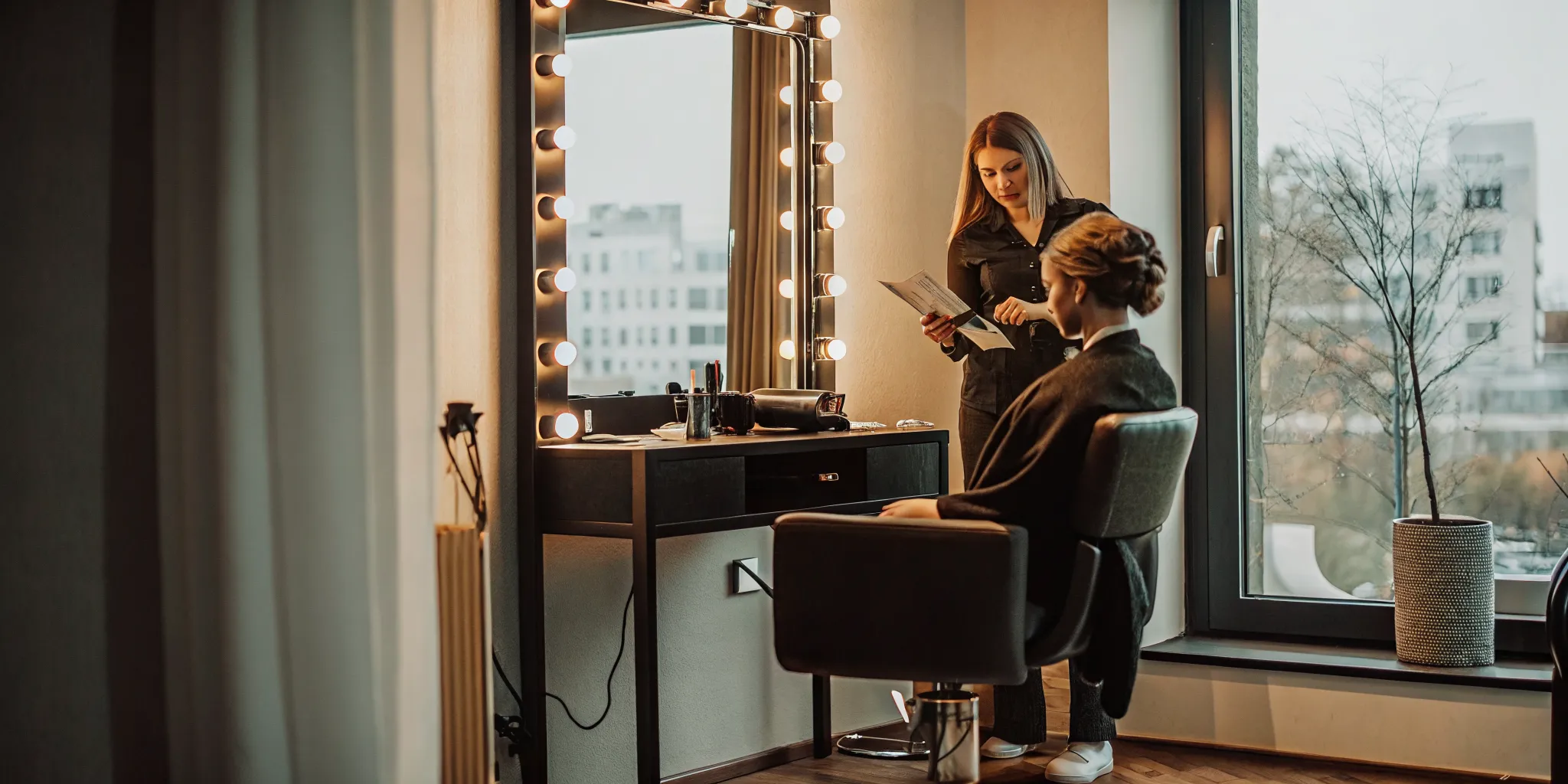Beauty professional reviewing a salon suite lease checklist inside a private suite