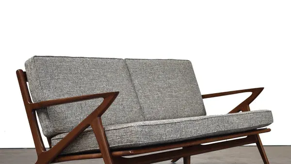 Gingko solid walnut sofa in a modern living room setting