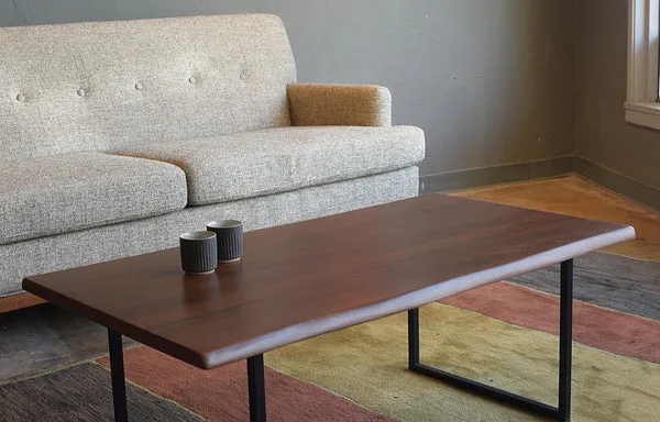 Walnut coffee table proportioned within a mid-century modern living room seating arrangement