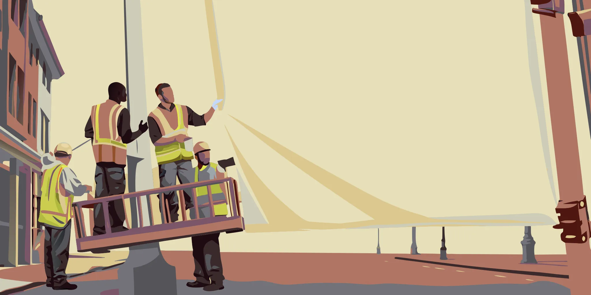 Professional banner installation crew securing an over-the-street banner between poles on a city street