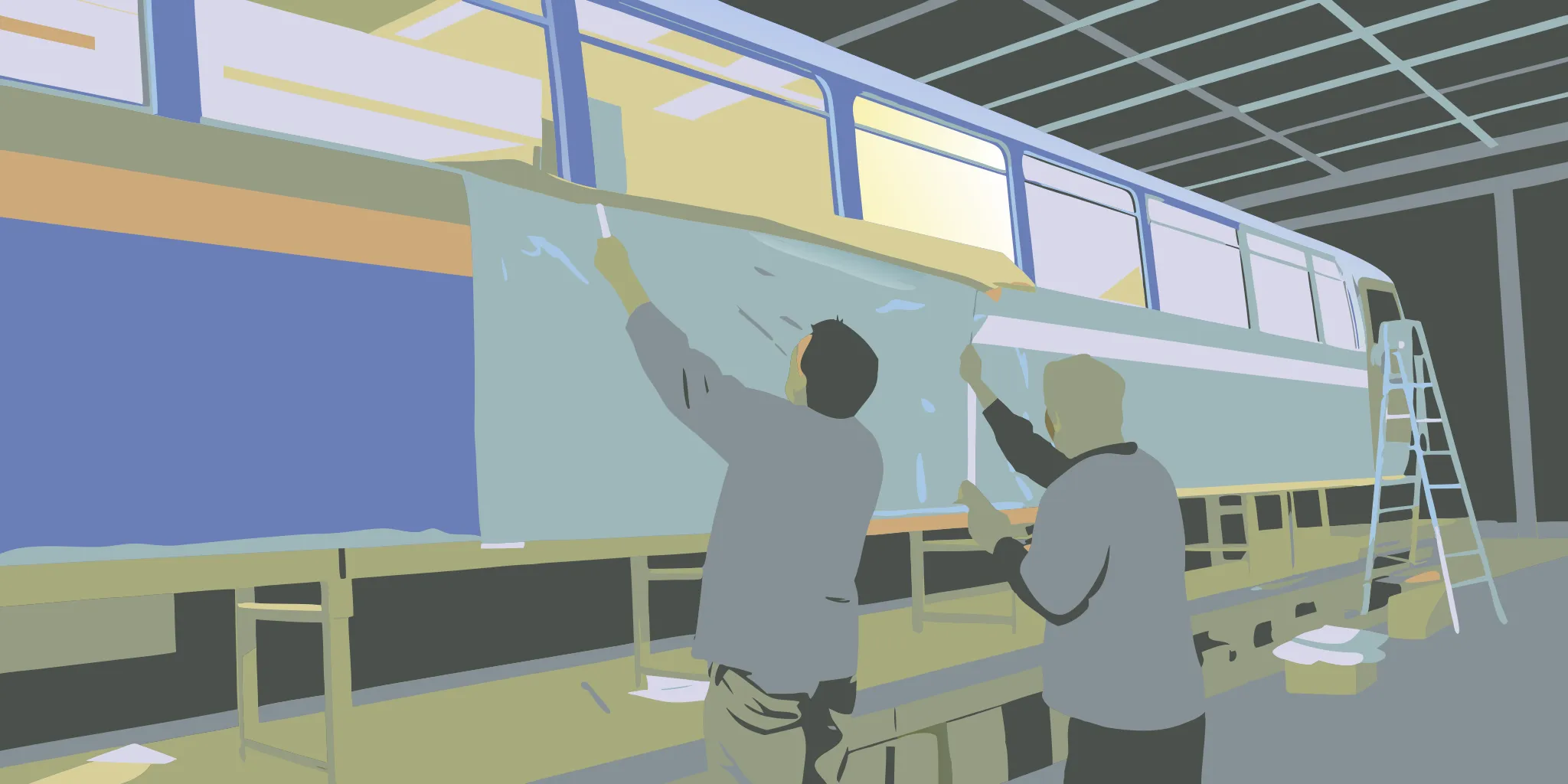 Professional team installing a transit bus wrap graphic on the side of a city bus in a bright workshop