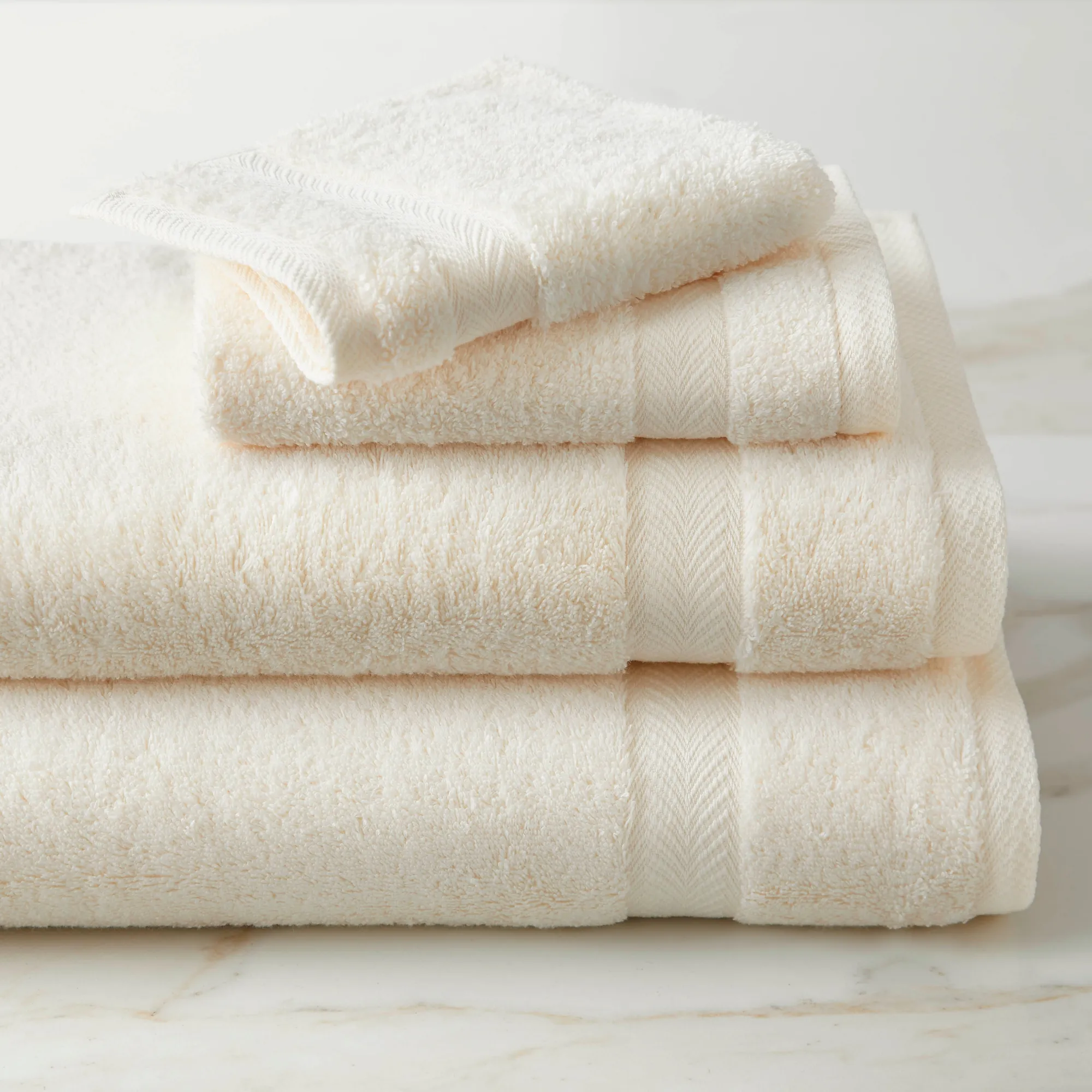 Cream Amalfi designer bath towel showing its refined weave and border detail