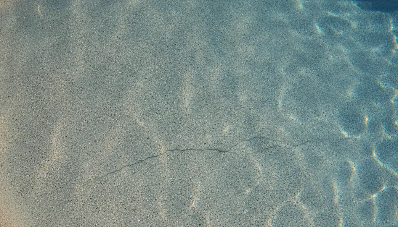 Fine surface crack visible in an Arizona pool finish