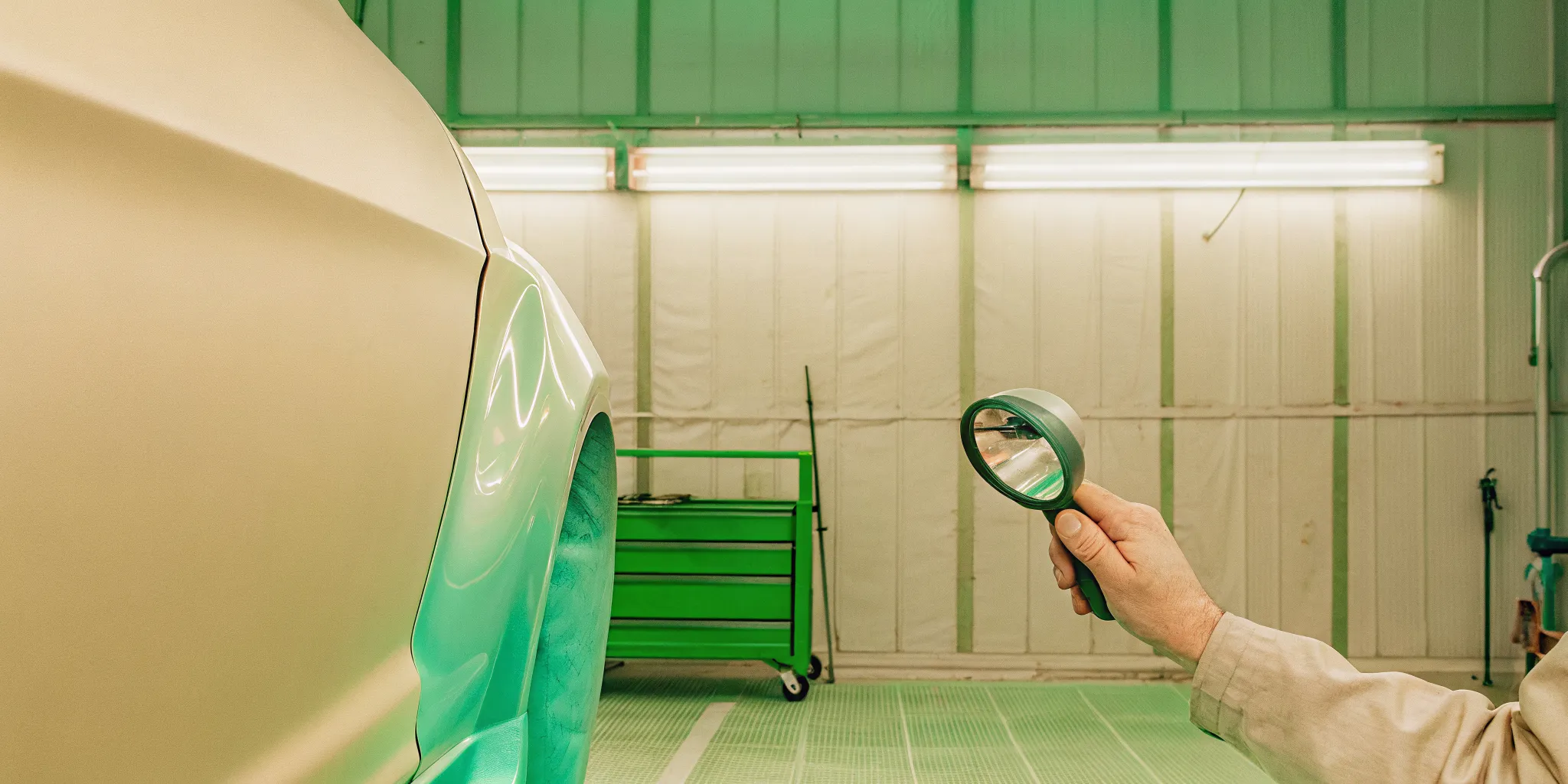Technician performing a car scratch repair Orlando assessment