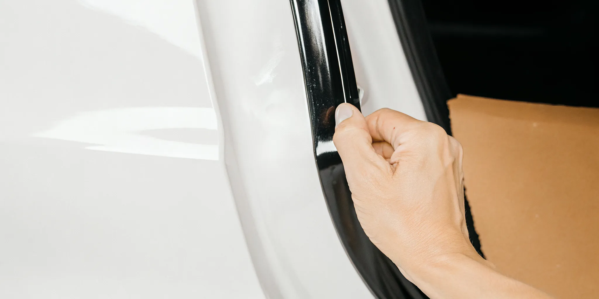 Close inspection of clear-coat damage for car scratch repair Orlando