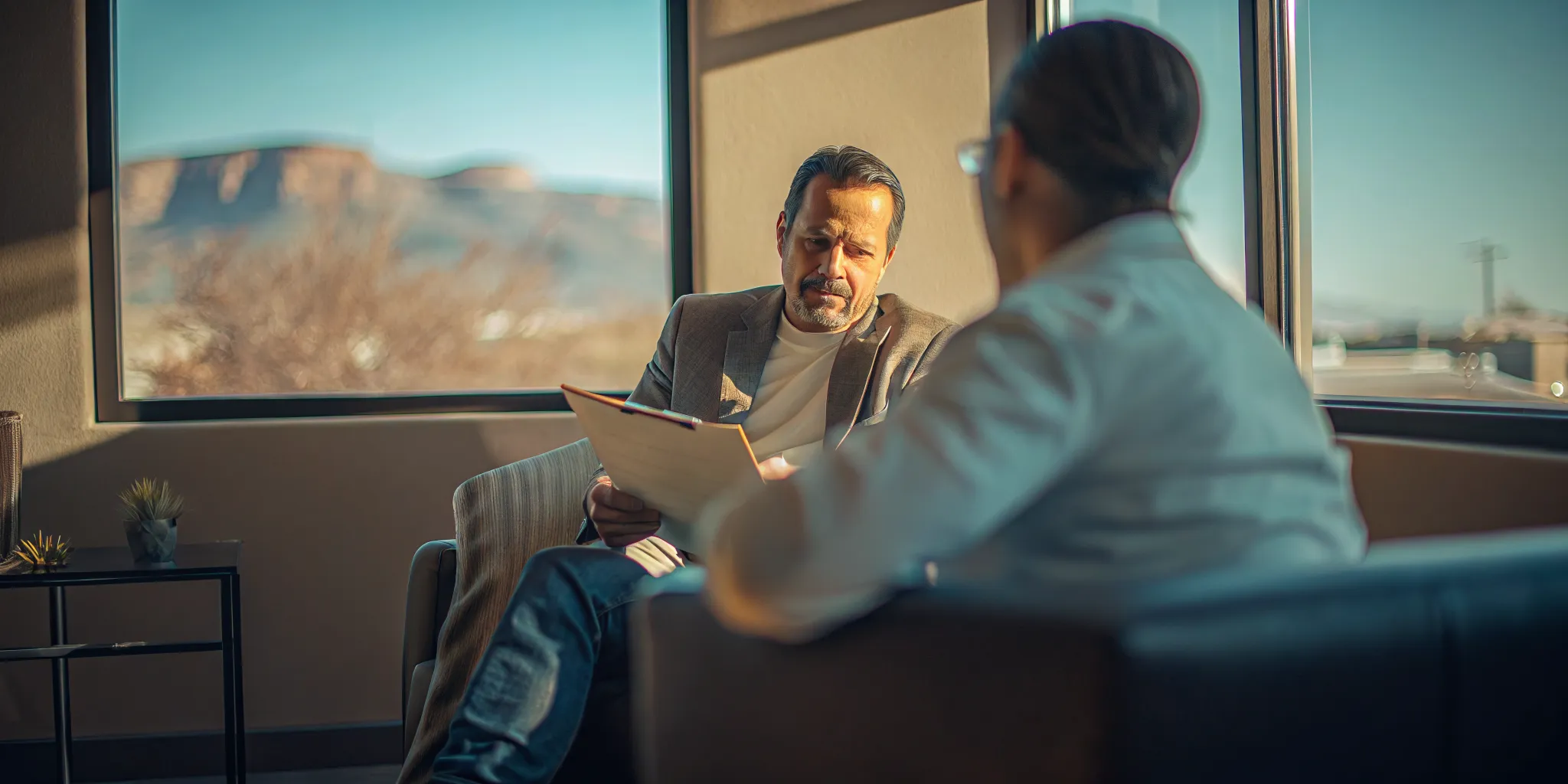 Veteran attorney discussing a New Mexico personal injury claim with a client