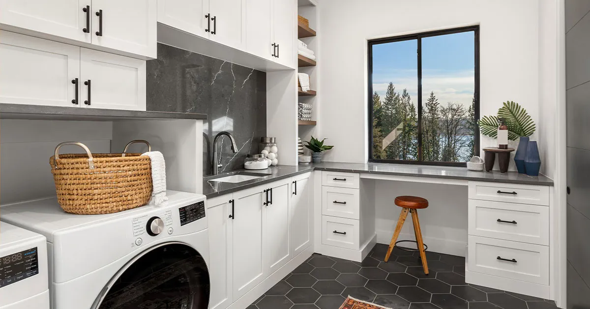 Laundry room storage with cabinets above appliances