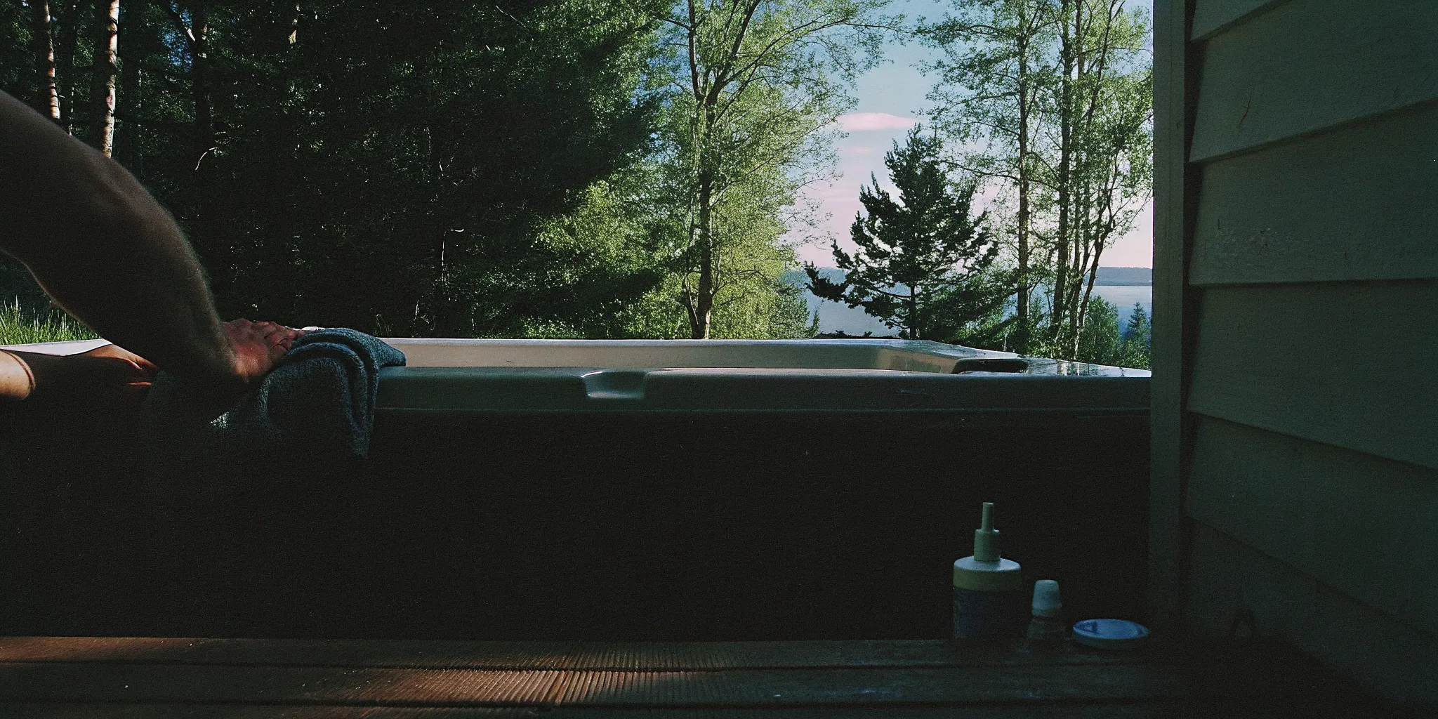 Homeowner wiping the shell during a cold plunge deep-clean
