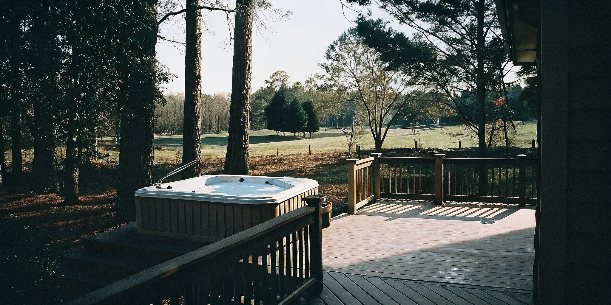 Composite deck surrounding a backyard hot tub