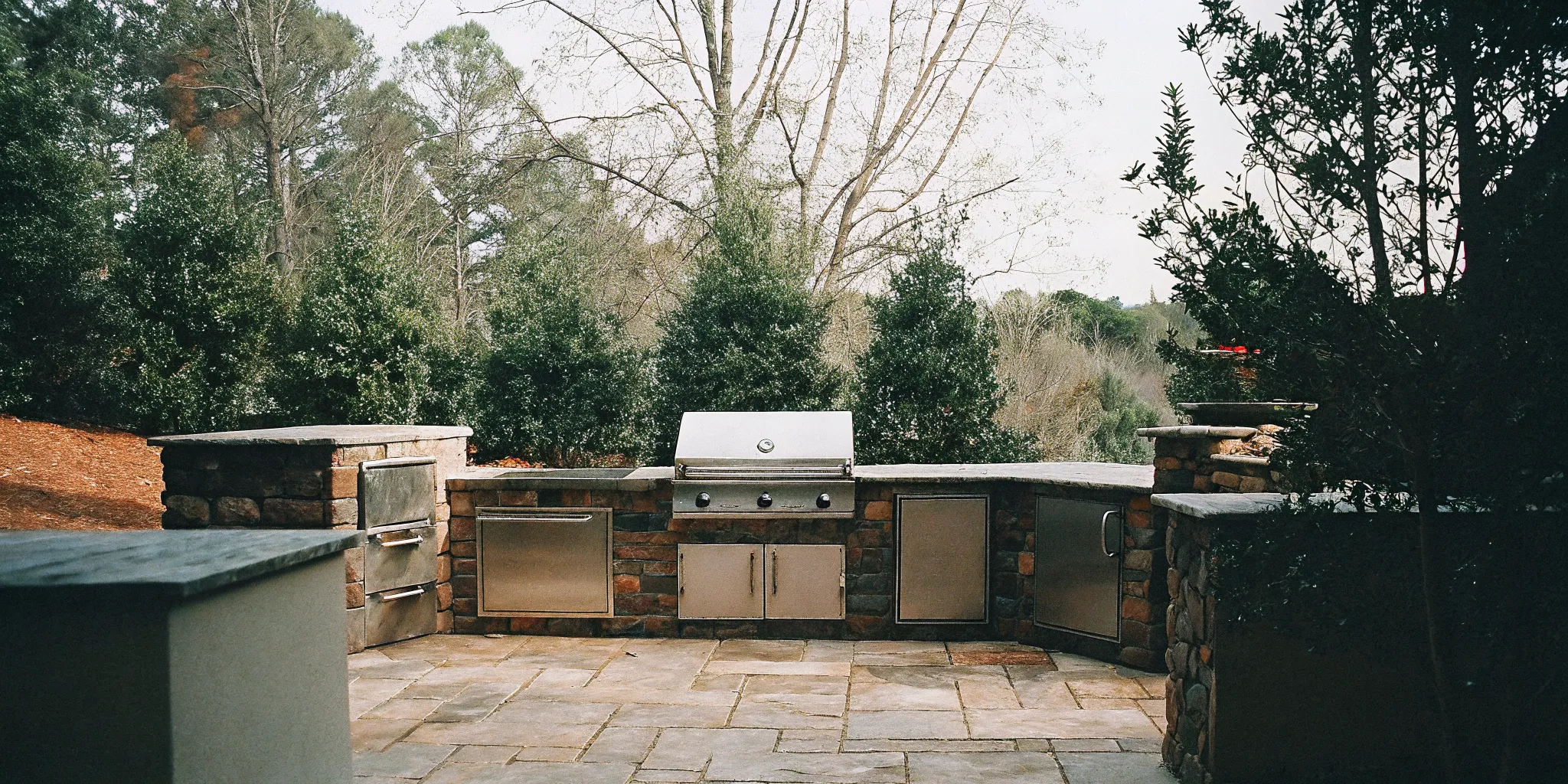 Outdoor kitchen site preparation and appliance layout planning in Charlotte