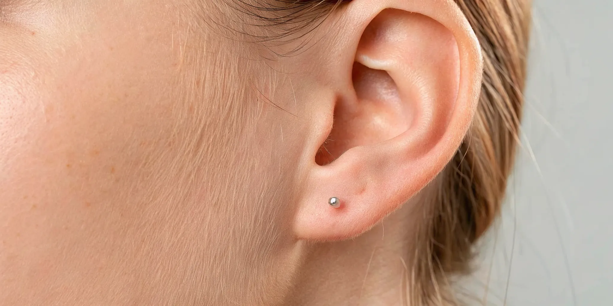 Healthy ear piercing compared with infected ear piercing symptoms
