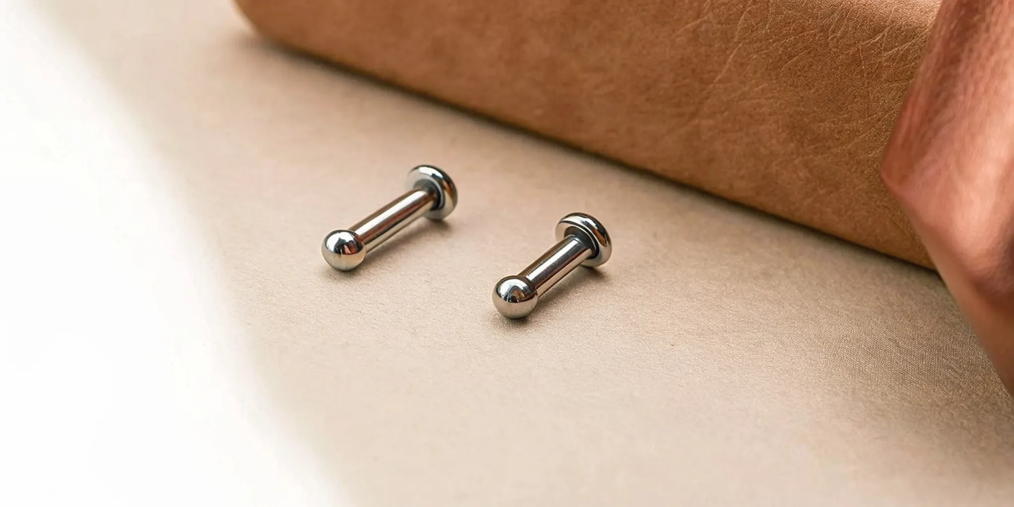 Close-up of internally threaded titanium body jewelry components