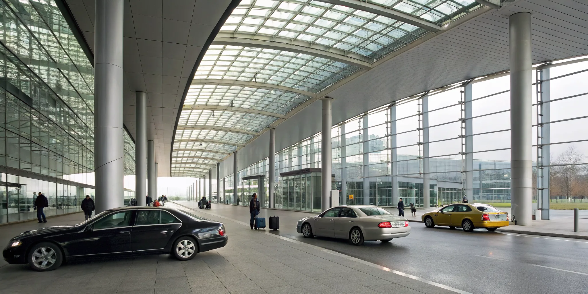 Limo, taxi, and rideshare cars lined up for passenger rides at the AC airport.