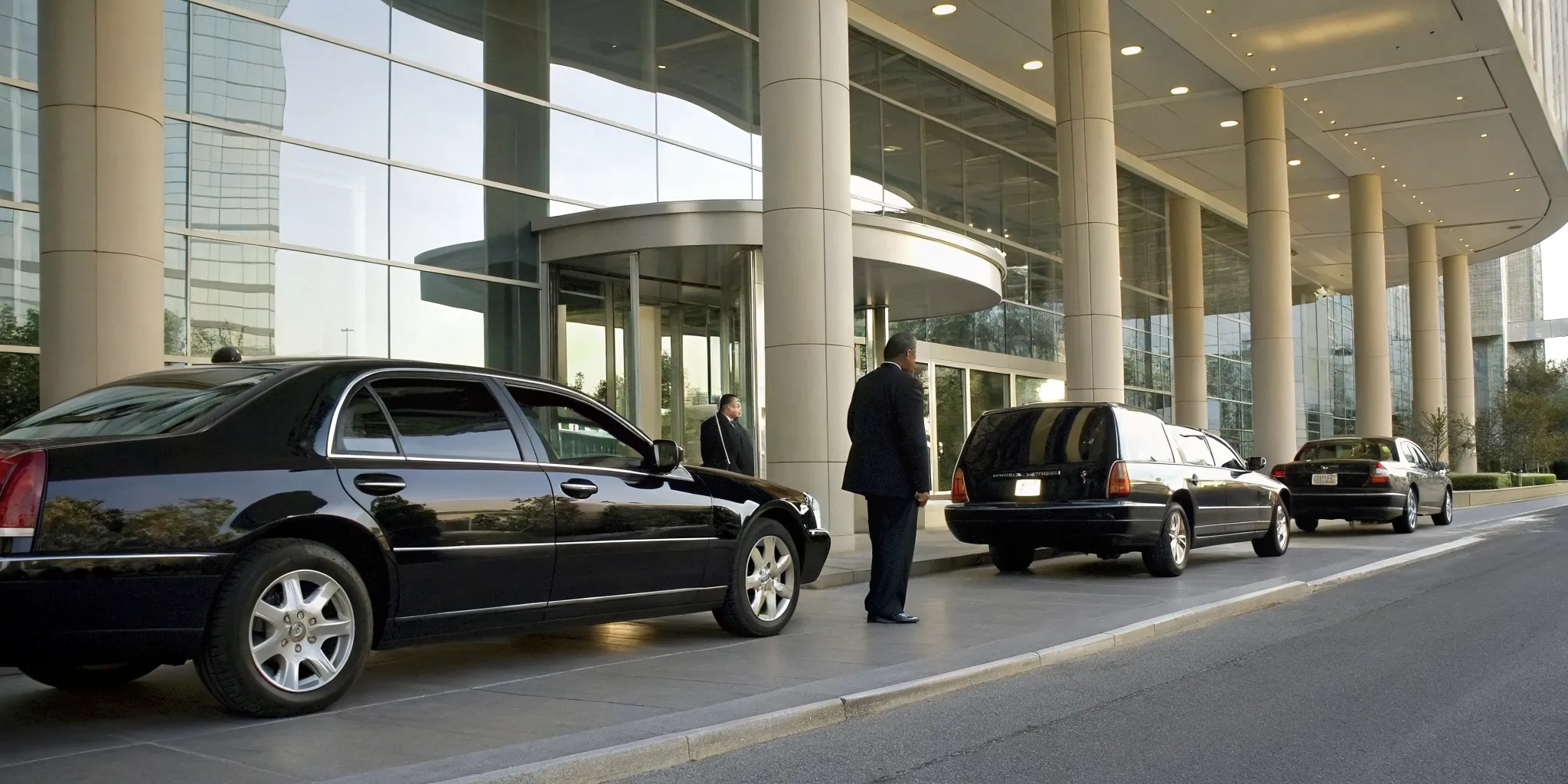 Black luxury sedans and professional chauffeurs for a Delaware executive car service.