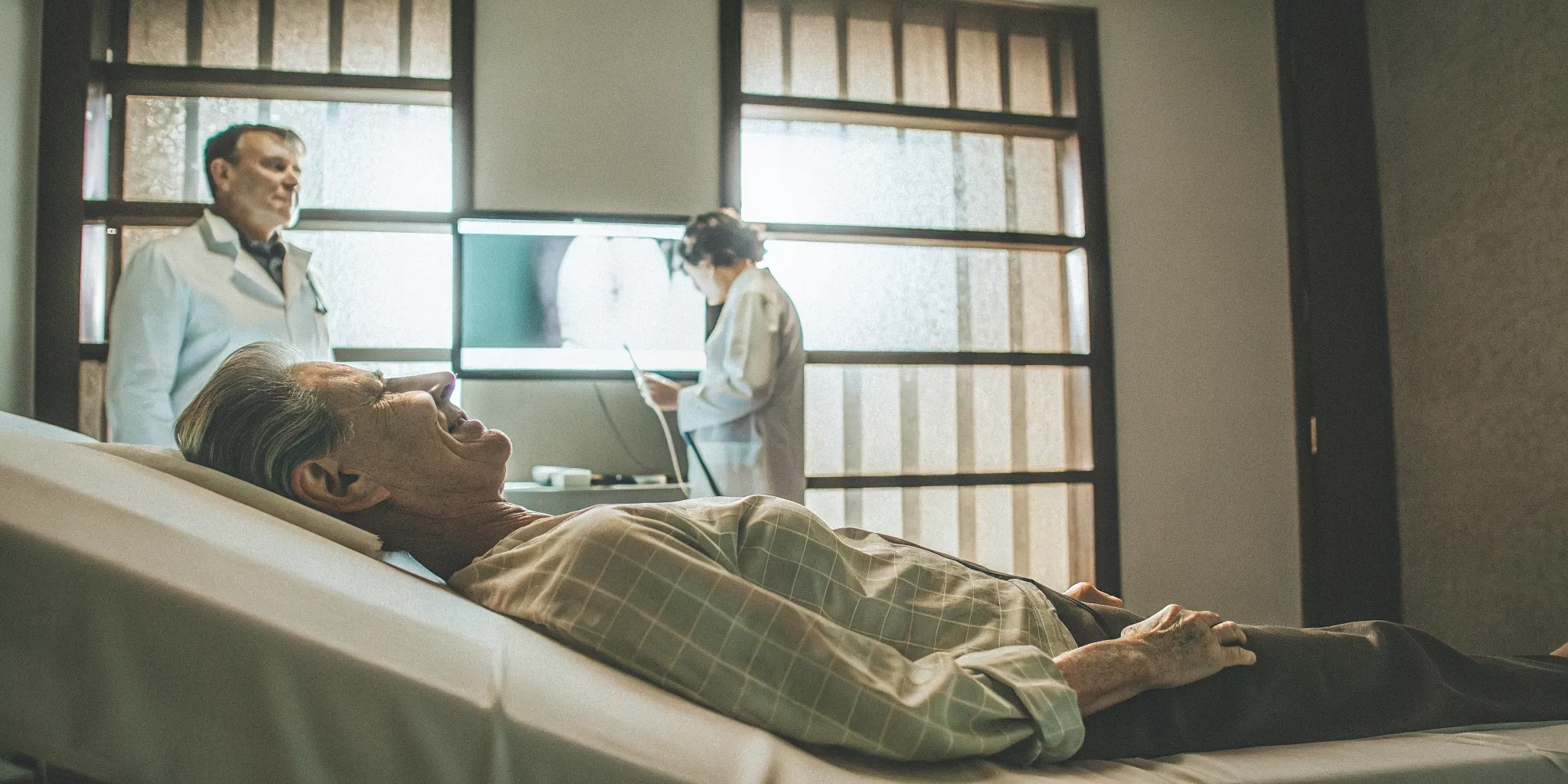 Patient lying comfortably on a DRX9000 spinal decompression table as a clinician monitors the session in a modern Chicago clinic