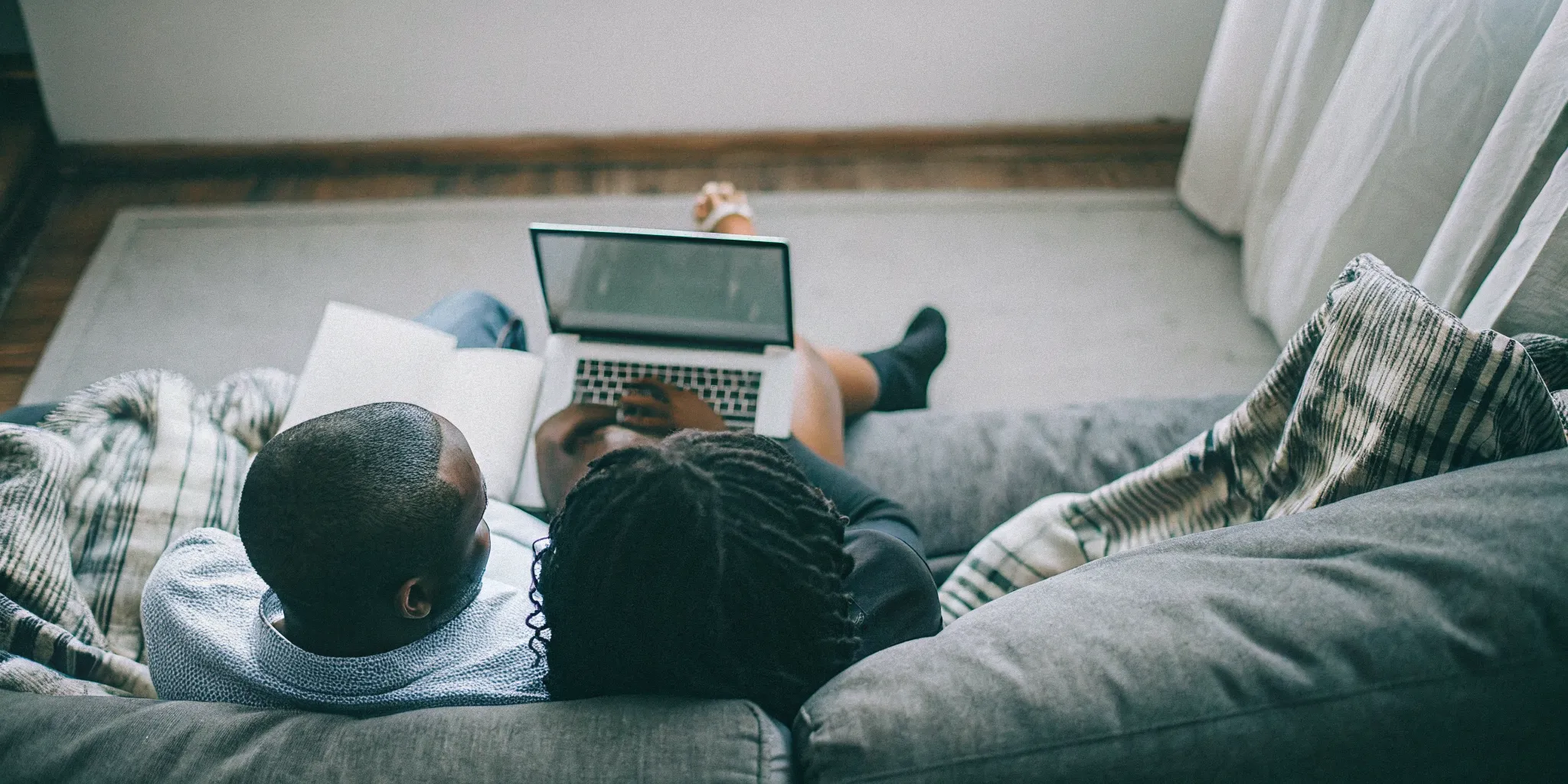 Couple preparing together for an online relationship counseling appointment