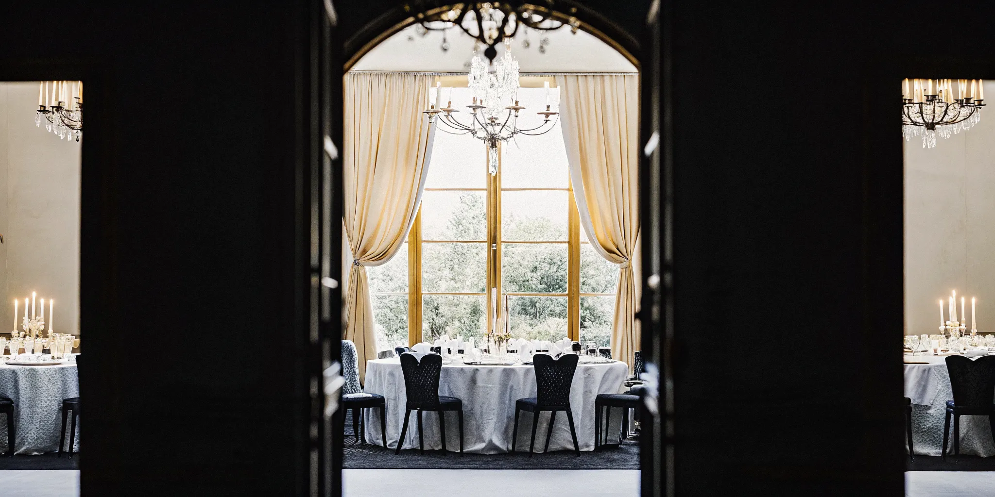 Luxury private estate dining room with elegant table setting and warm lighting for executive retreat dinners