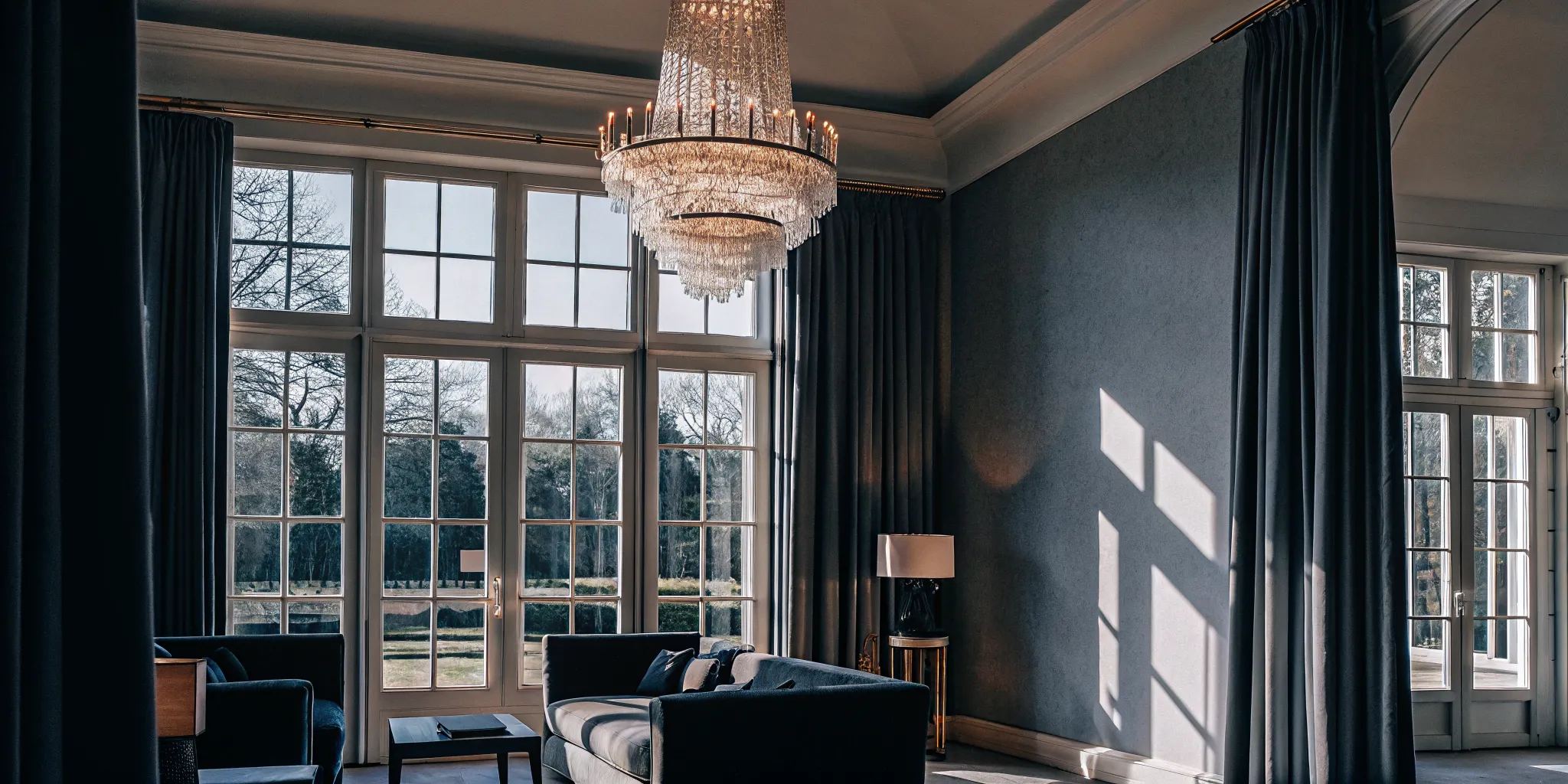 Elegant interior great room of a French Chateau-style estate with high ceilings and natural light