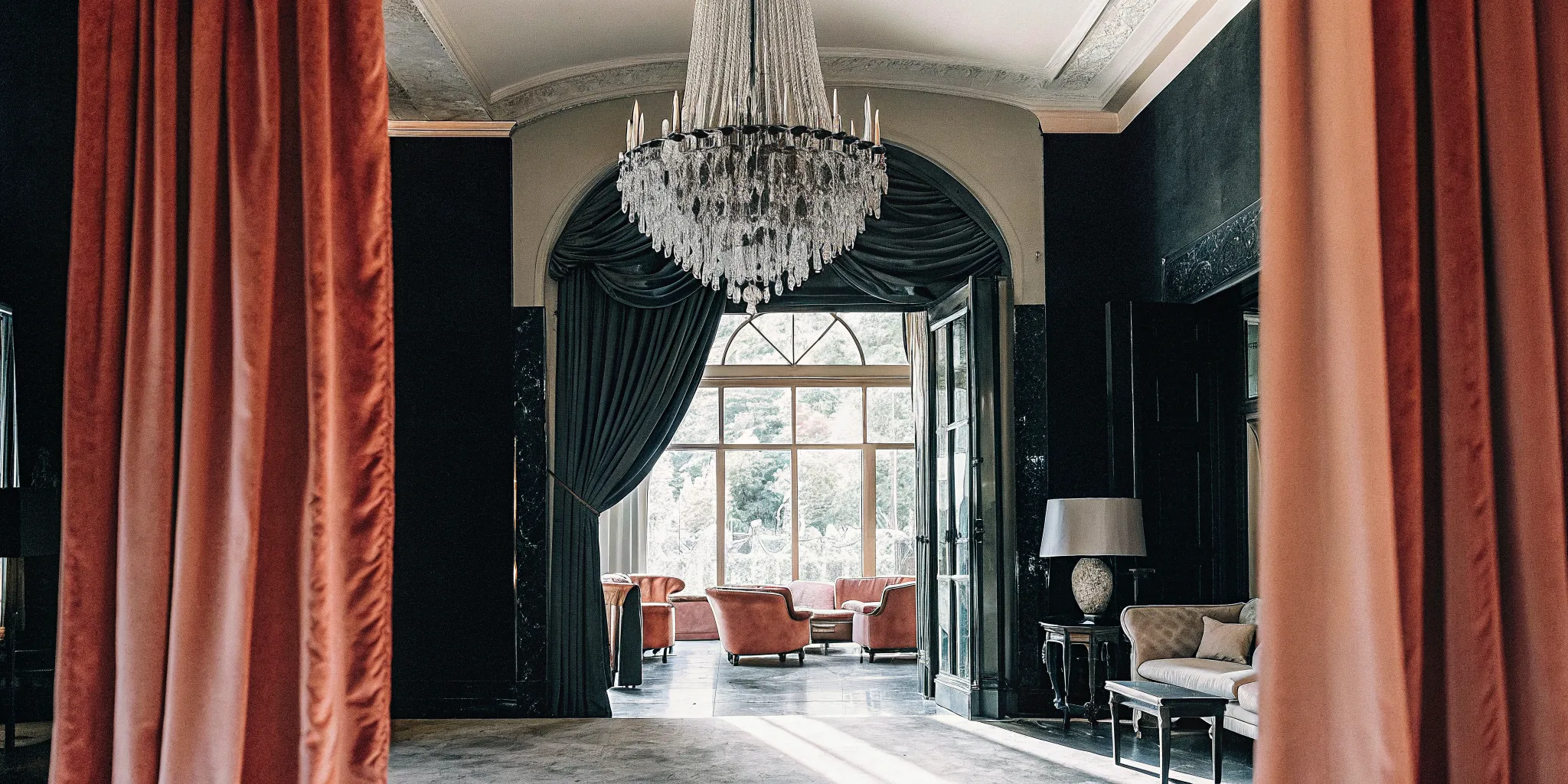 Grand salon interior of a French Chateau-inspired private estate with high ceilings, chandelier, and refined furnishings