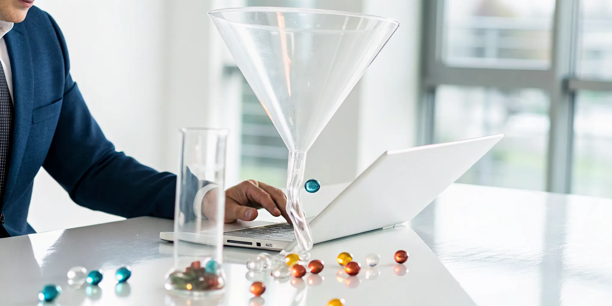 A man analyzing a sales funnel on his laptop to spot pipeline risk early.