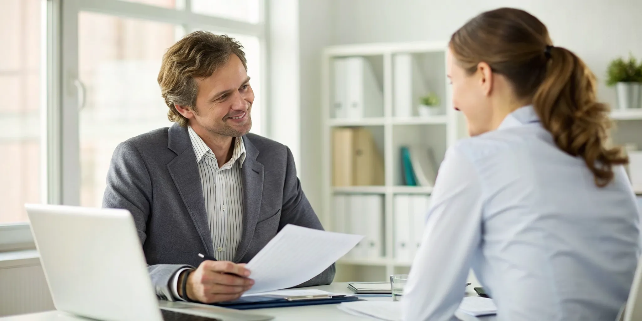 Staffing agency owner working with an operations partner to improve account service