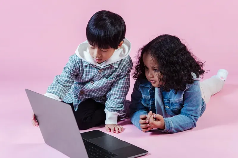 Diverse group of children learning together through online platforms