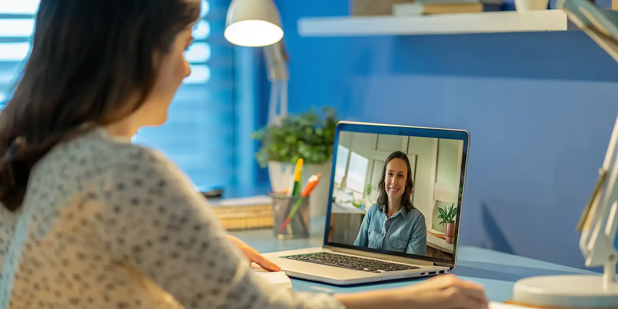 High school student participating in a live online class at home