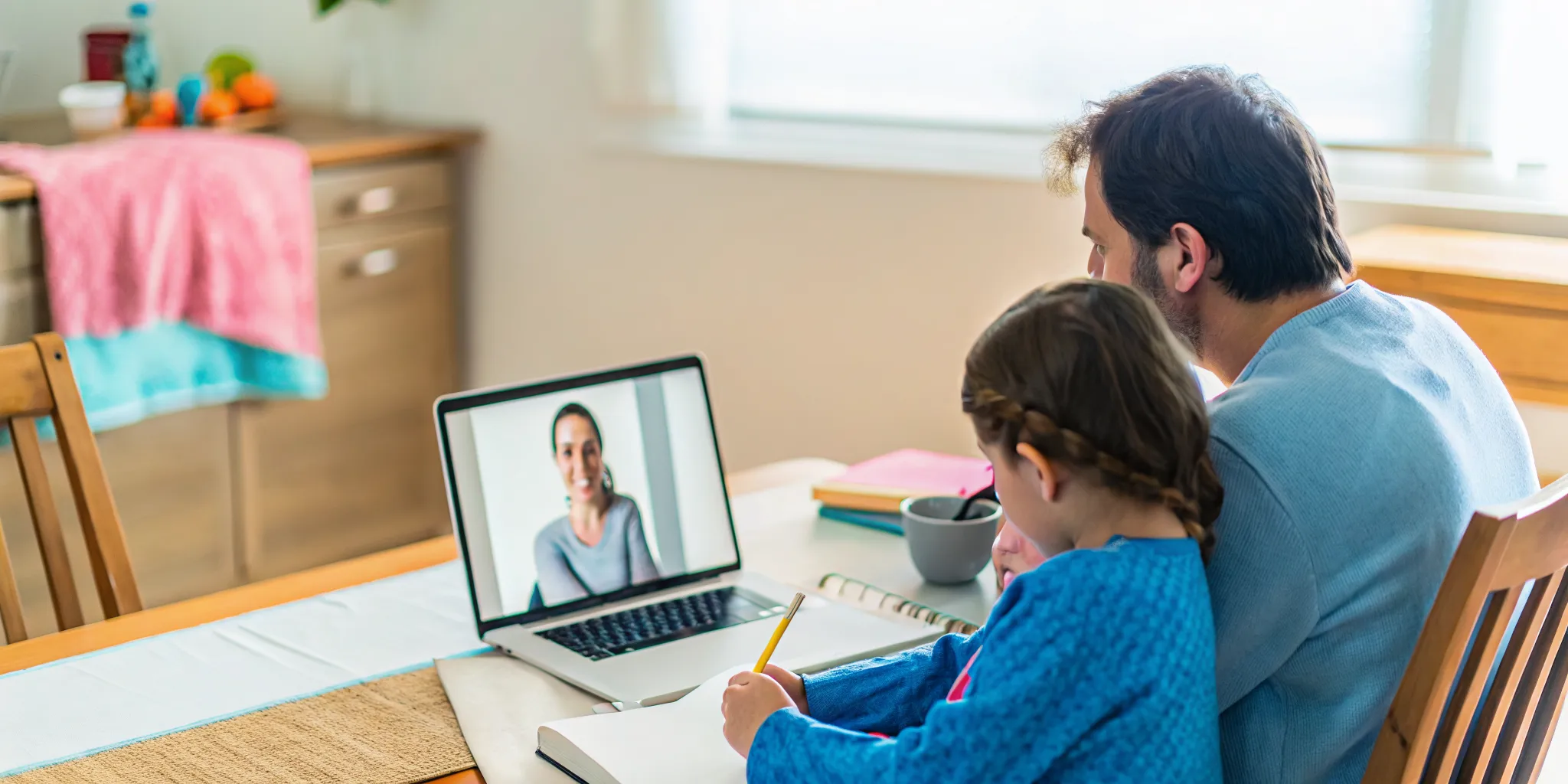Parent and child comparing bilingual online school options