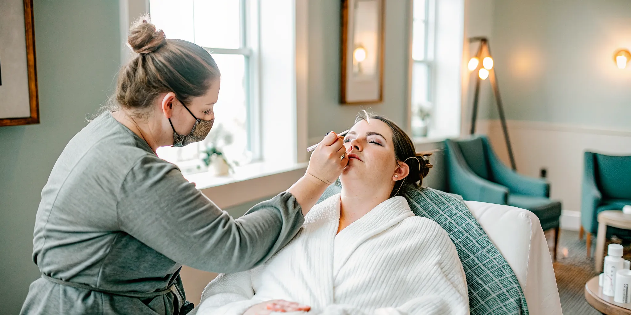 Esthetician performing facial waxing on a bride at a professional salon