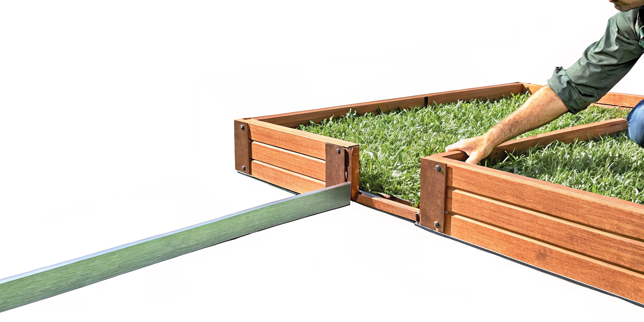 Gardener assembling a modular composite raised garden bed