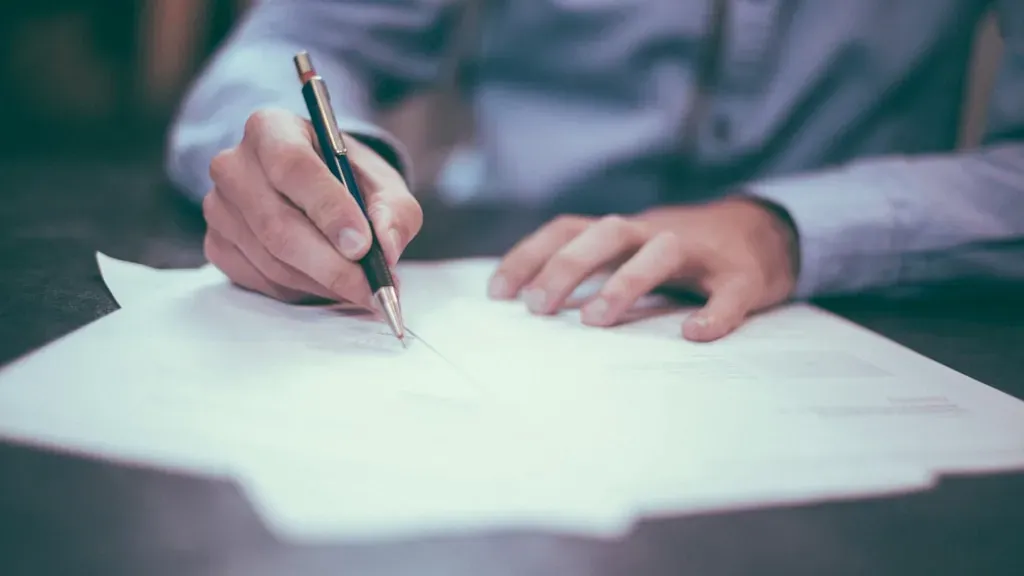Senior reviewing Medicare insurance documents and comparing health insurance broker options
