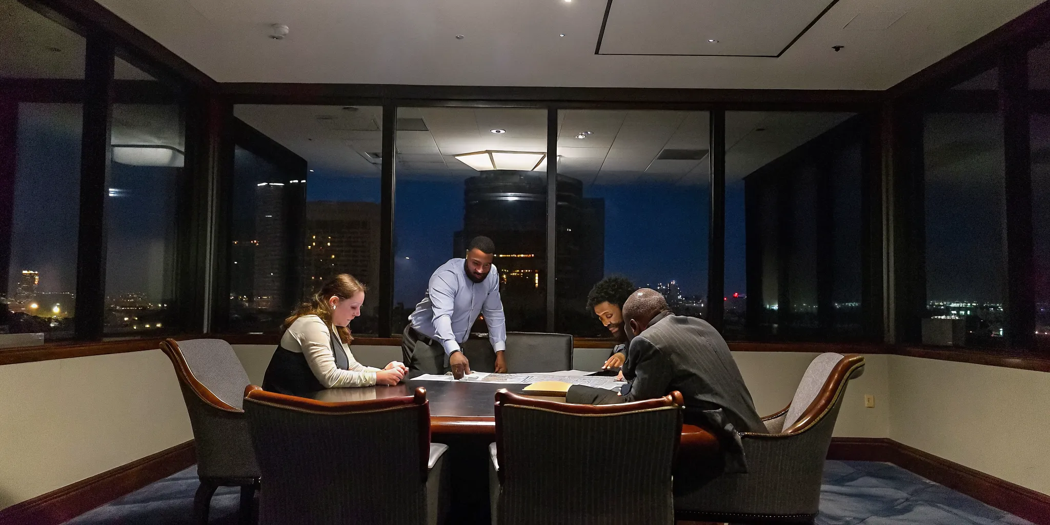 Dallas leadership training team aligning priorities in a modern boardroom