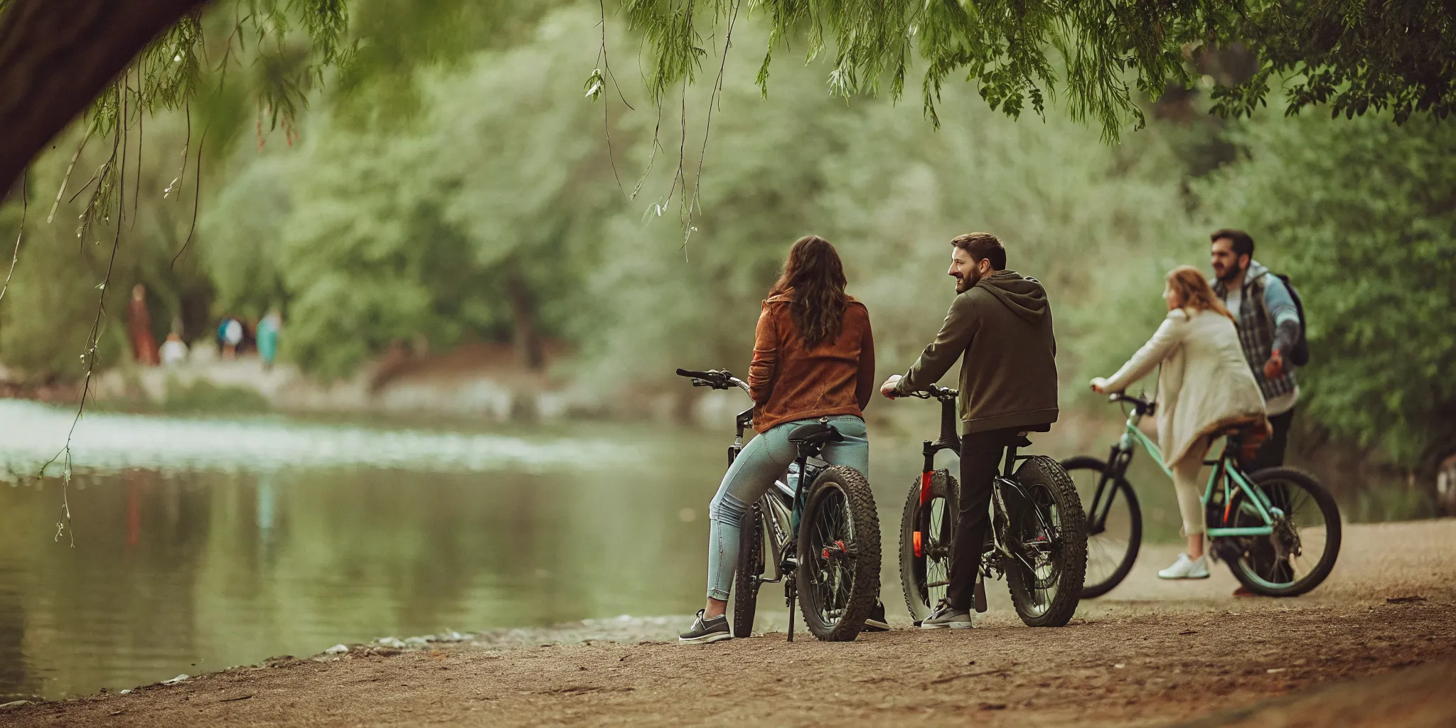 Guided eBike riders at Rainbow Park on the shore of Alta Lake with mountain views in Whistler