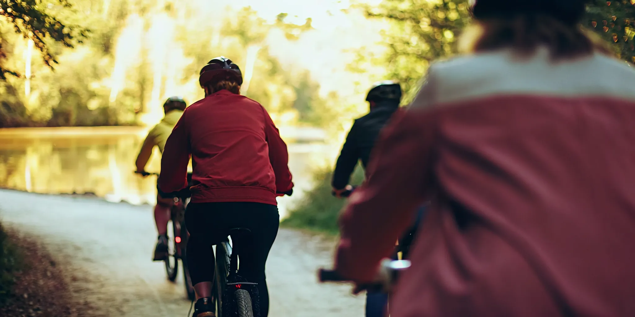 Guided fat tire eBike riders on the paved Valley Trail beside the River of Golden Dreams in Whistler