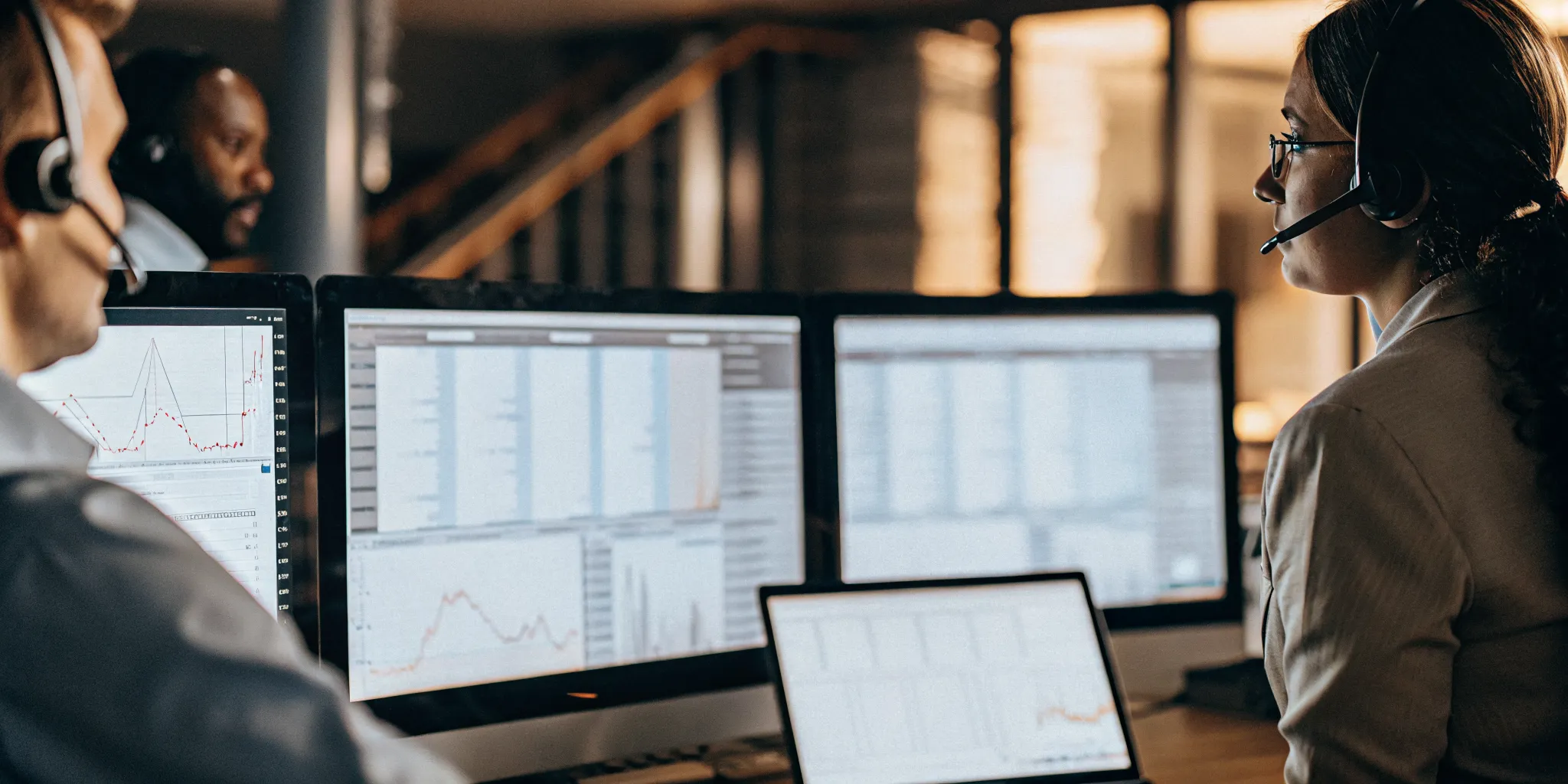 Hospitality contact center leader reviewing guest service analytics across properties