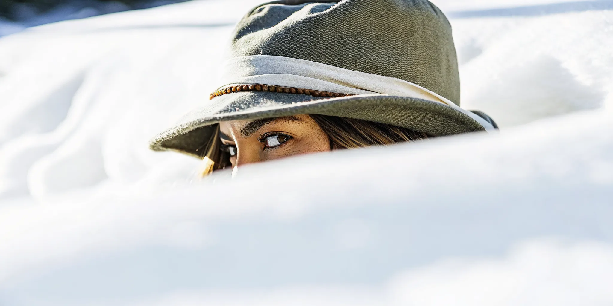 Woman with healthy color-treated hair wearing a winter hat with silk lining for protection