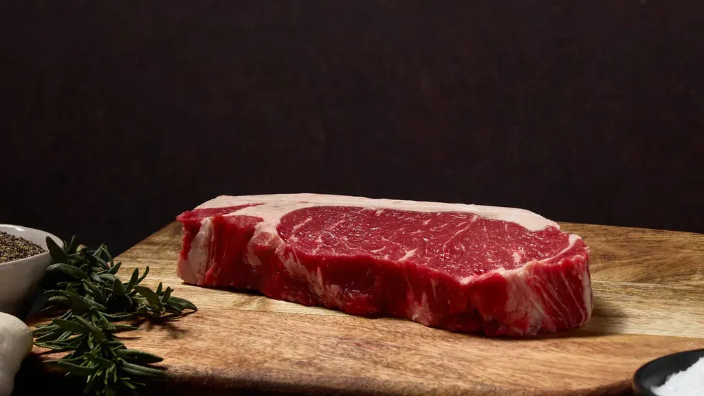 Dry-aged New York strip steak ready for a hot skillet