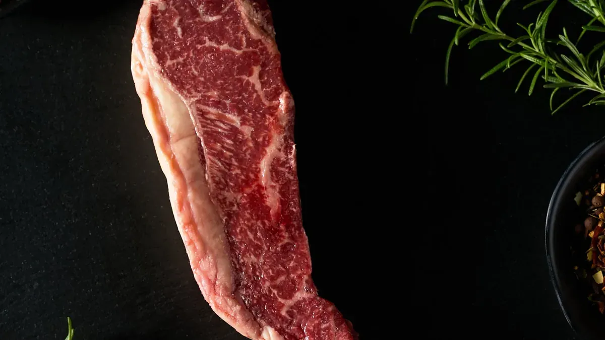 Fullblood Wagyu New York strip steak on a serving platter