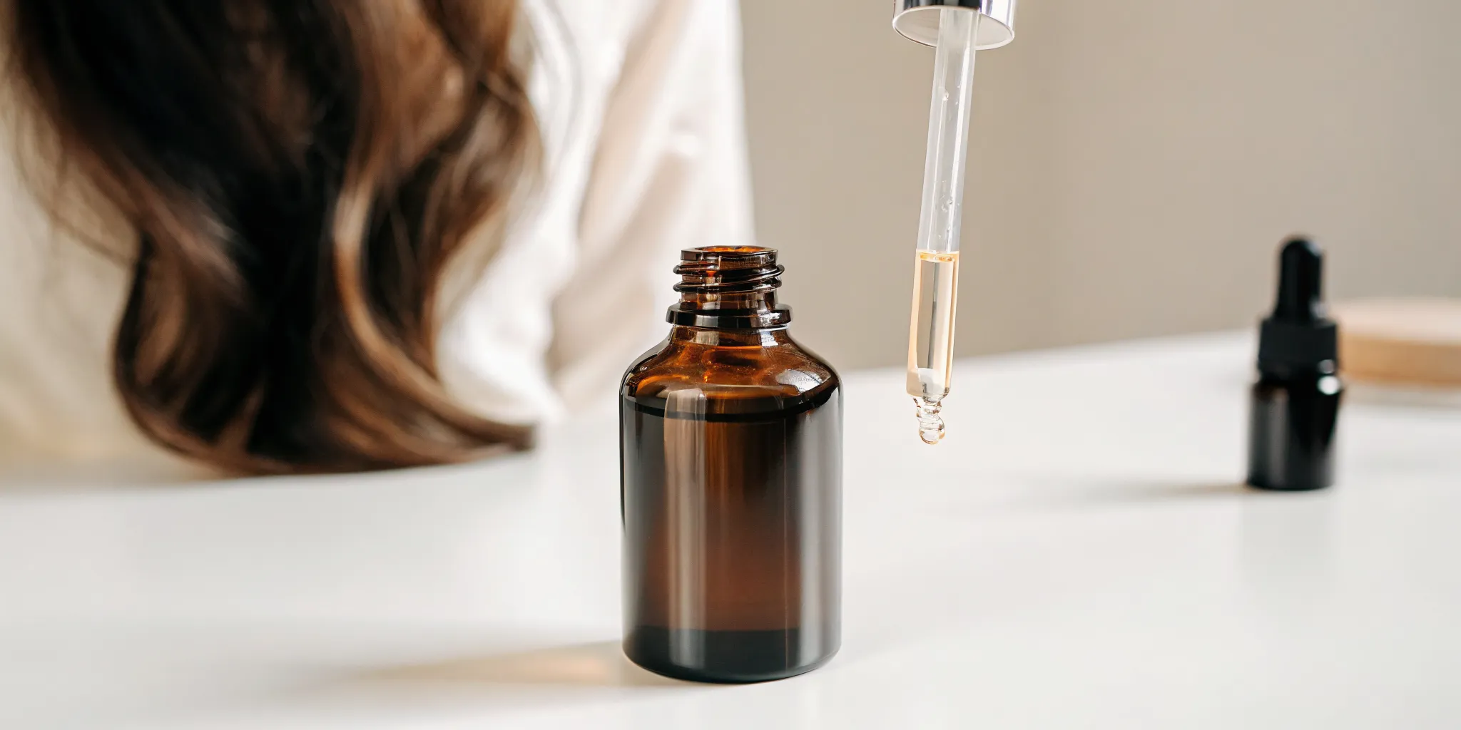A premium glass dropper bottle of compounded hair growth solution